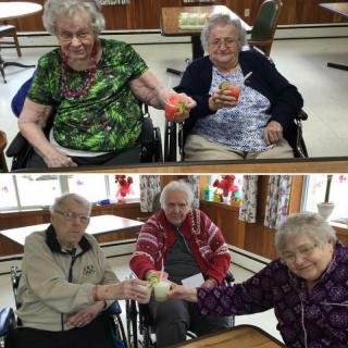 Elderly friends enjoying a celebration together.