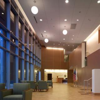 A modern lobby with comfortable seating and a reception desk.