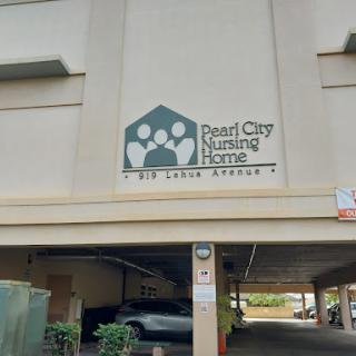 Signage for Pearl City Nursing Home located in a parking garage.