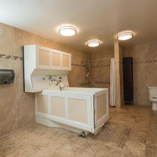 A modern bathroom featuring a clean design with a sink, toilet, and shower.