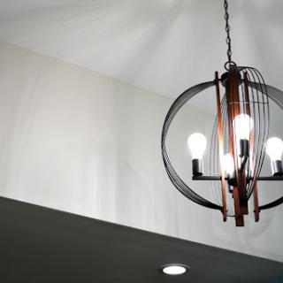 A stylish chandelier with multiple light bulbs, enhancing the modern interior.
