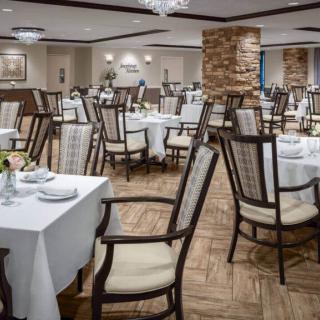 Elegant restaurant dining area with neatly arranged tables and chairs.