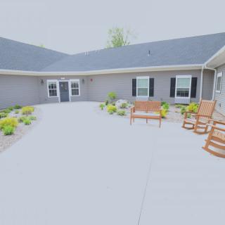 A cozy courtyard with outdoor seating and well-maintained landscaping.