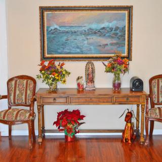 A beautifully decorated interior with elegant furniture and floral arrangements.
