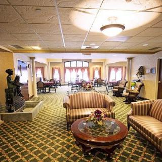 A spacious hotel lobby with comfortable seating areas and elegant decor.