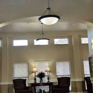 A spacious and elegantly designed lobby featuring modern furniture and ample natural light.