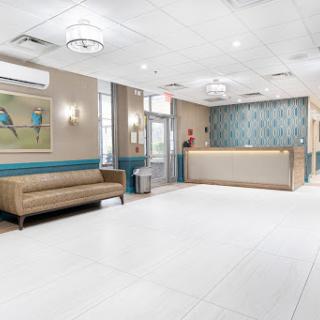 A modern and inviting lobby with a reception desk and comfortable seating.