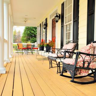 A serene porch setup with comfortable rocking chairs, perfect for enjoying the outdoors.
