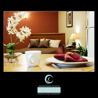 A cozy and elegantly decorated bedroom with a dining setup, perfect for comfort and hospitality.