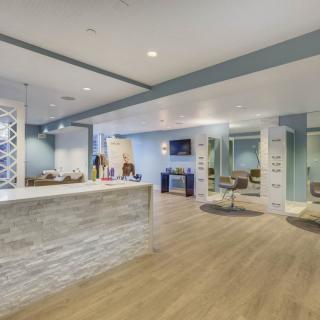 A modern reception area with stylish decor and comfortable seating.