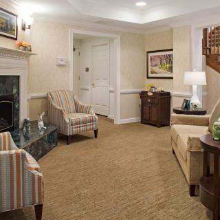 A cozy living room with comfortable seating and warm lighting.