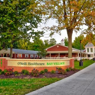 Exterior view of a healthcare facility during autumn.