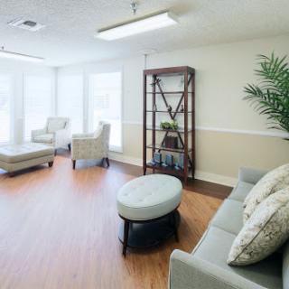A bright and inviting lounge area featuring comfortable seating and modern decor.