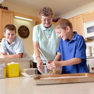 Kids enjoying a fun cooking session in the kitchen.