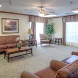 A cozy living room with traditional furniture and warm lighting.