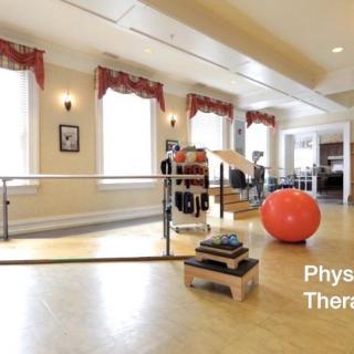 A well-equipped physical therapy room with various exercise tools.