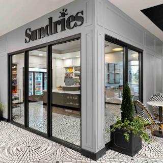 Modern sundries store with glass entrance and stylish interior.