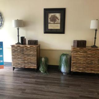 A cozy living room setup featuring decorative furniture and ambient lighting.