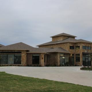 A modern residential house with a unique architectural design and spacious front area.