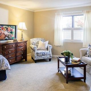 A cozy living room with elegant furniture and soft lighting.