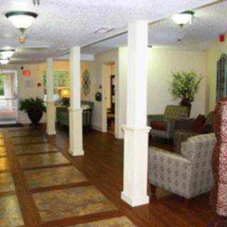 A spacious and well-lit lobby with comfortable seating and decorative elements.