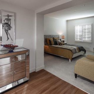 A modern bedroom with stylish furniture and elegant decor.