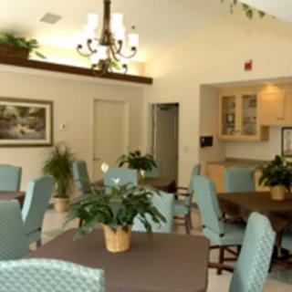 A cozy dining area with plants and elegant decor.