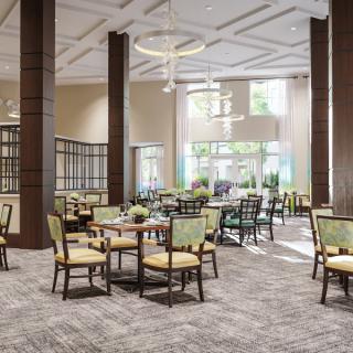 A modern dining area featuring elegant tables and chairs with large windows letting in natural light.