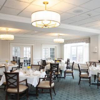 A beautifully arranged dining room with elegant decor and ample natural light.