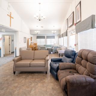 A bright and welcoming living room with cozy seating and a spacious layout.