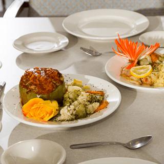 A gourmet meal served on a table with an elegant setting.