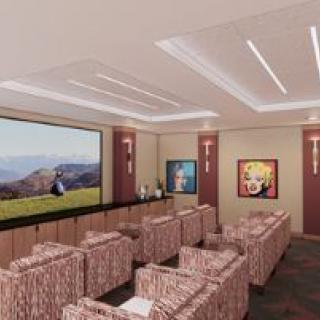 A stylish home theater with comfortable seating and a large screen for viewing.
