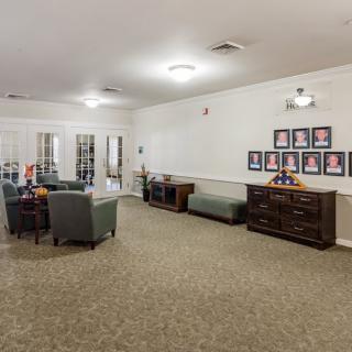 A spacious living room with comfortable seating and decor.