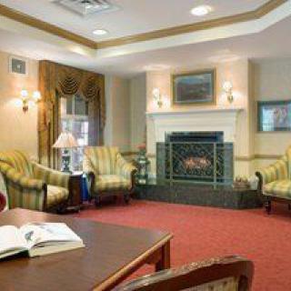A cozy living room with a fireplace and comfortable seating.