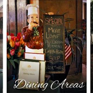 A welcoming entrance with a chef statue and chalkboard displaying the daily specials in a dining area.