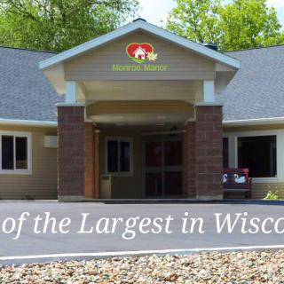 A large building entrance surrounded by trees, located in Wisconsin.