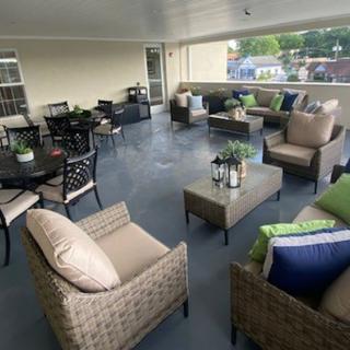 A spacious outdoor patio with comfortable seating and decor.