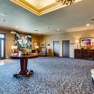 Spacious lobby area with elegant decor and elevators.