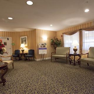 A cozy waiting room with comfortable seating and warm lighting.