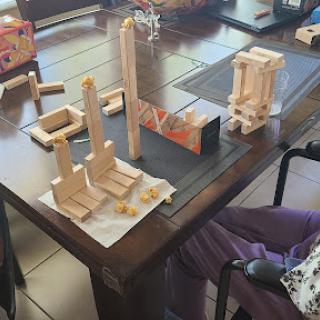 A creative building session with wooden blocks on a table.