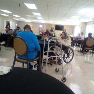 A group of seniors engaging in activities at a community center.