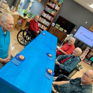 Seniors enjoying a social activity in a community center.
