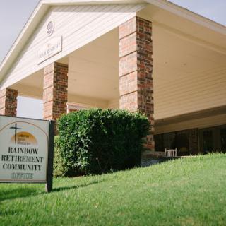 A welcoming community building with a prominent sign.