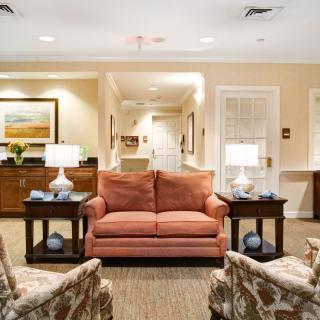 A cozy living room with a comfortable sofa and elegant lighting.
