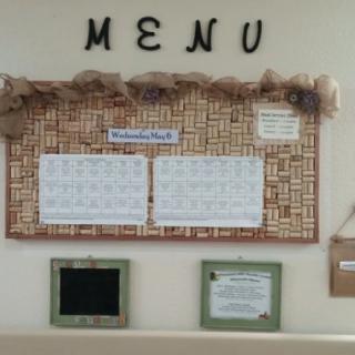A decorative bulletin board displaying a menu.