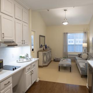 A modern open-layout kitchen and living area with stylish furnishings.