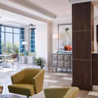 A modern lobby with comfortable seating and abundant natural light.