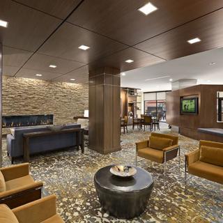 Modern lobby with comfortable seating and stone accents.