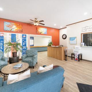 A welcoming lobby with modern furnishings and a warm color palette.