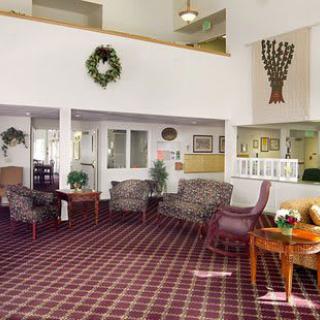 A cozy lobby area with comfortable seating and decorative elements.